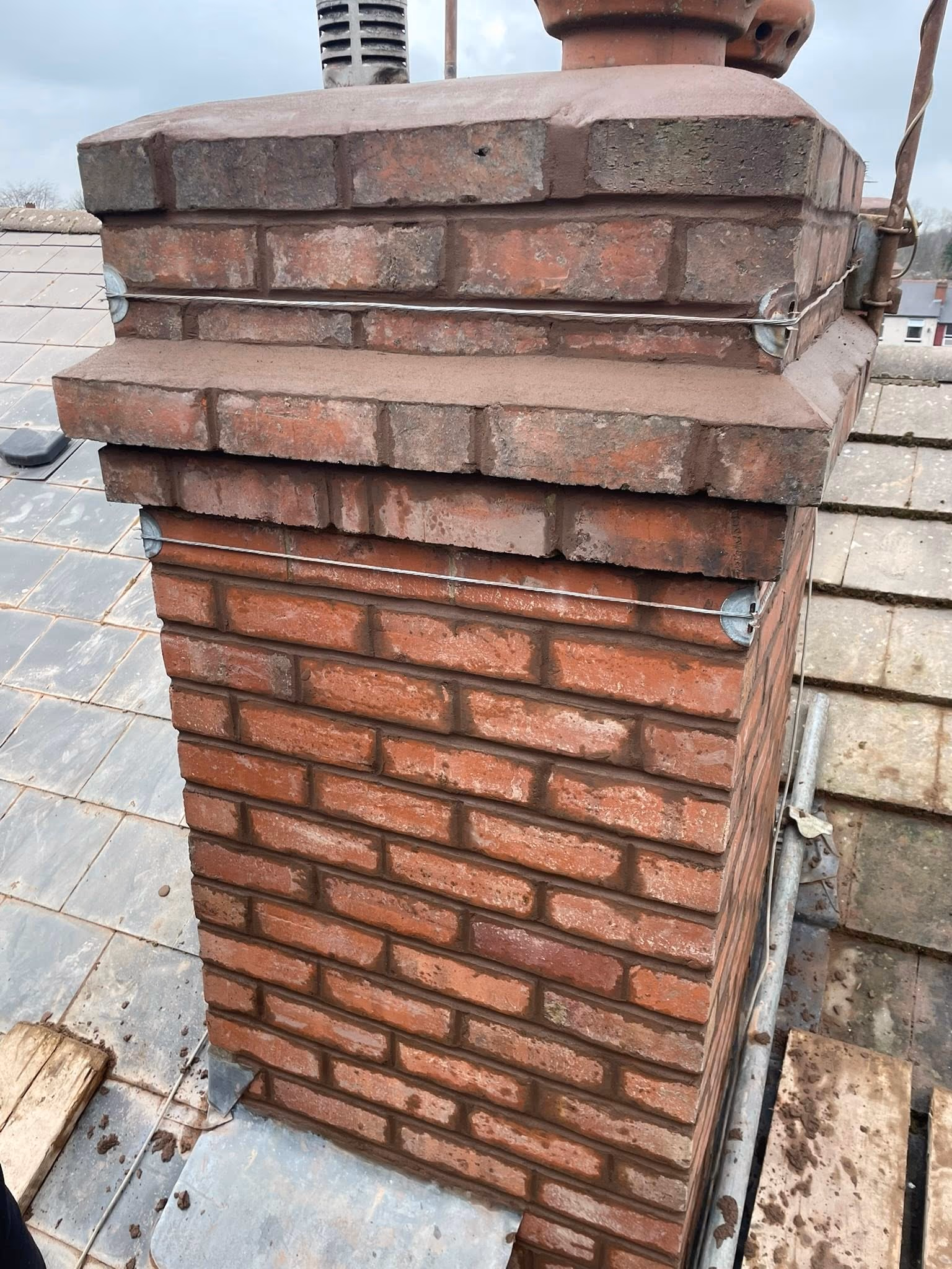 Re-bedded ridge tiles